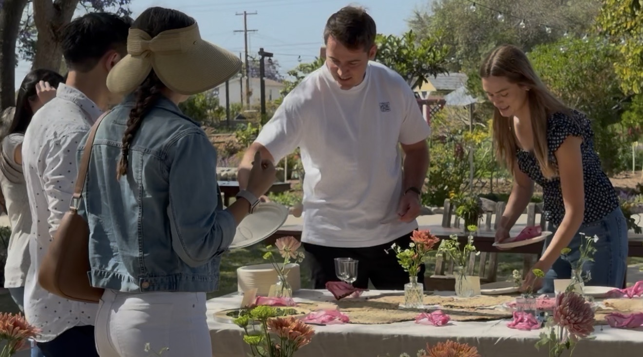 Guests gathering around and engaging with the styled garden table