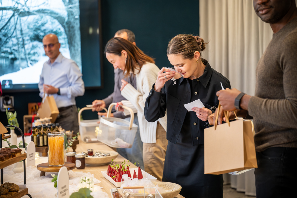 Guests tasting and gathering around a styled workplace experience