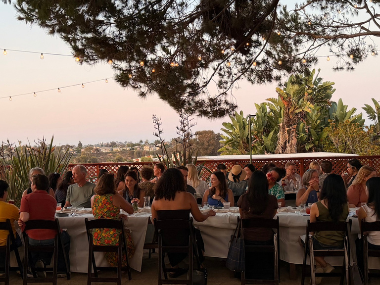 Guests gathered beneath the cyanotype canopy for the family style dinner